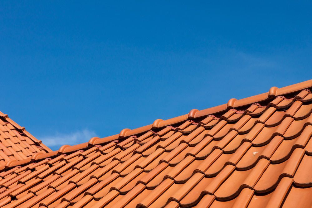 Roof Tile Pattern Over Blue Sky — Goonellabah Roof Tilers In Casino, NSW