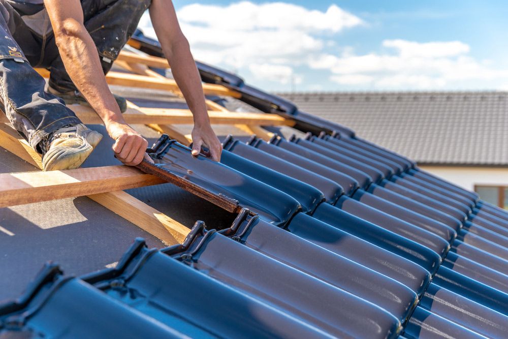 Worker Installing New Tile Roofing — Goonellabah Roof Tilers In Monaltrie, NSW