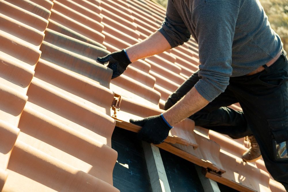Roofer Working on Placing Roof Tiles — Goonellabah Roof Tilers In Monaltrie, NSW