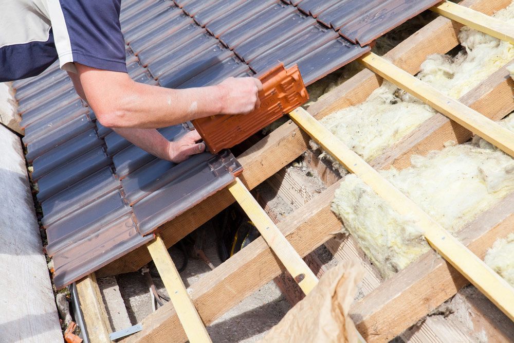 Roofer Laying Tiles — Goonellabah Roof Tilers In Monaltrie, NSW