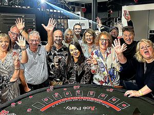 Corporate guests enjoying a fun casino table with playing chips at an event in South Yorkshire