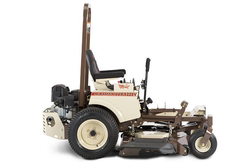 a brown and white grass hopper 1255v lawn mower