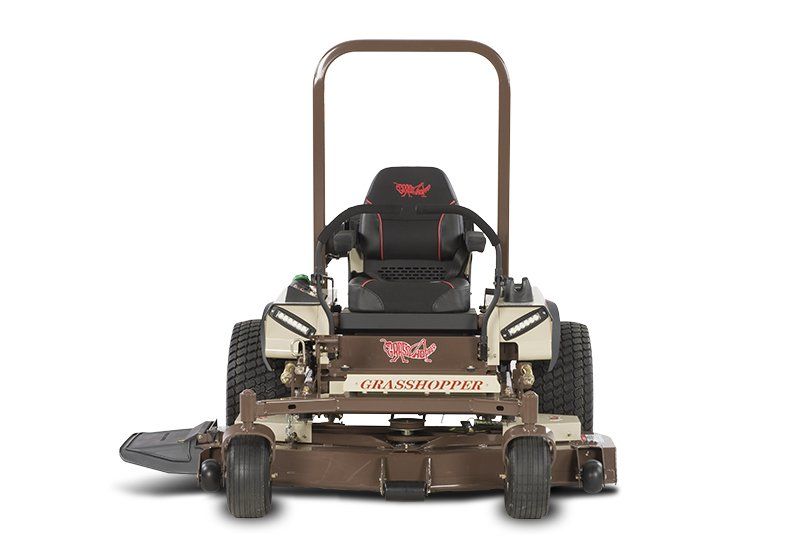 a brown and white grasshopper lawn mower on a white background