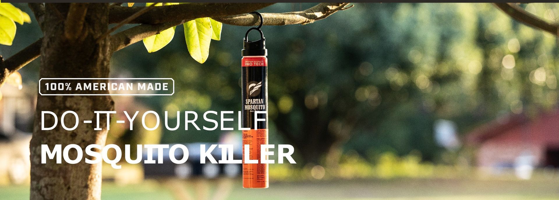 a mosquito killer is hanging from a tree branch