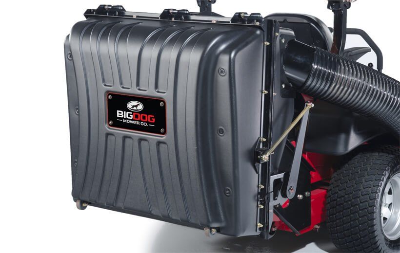 A Big Dog mower with a big bag attached to it
