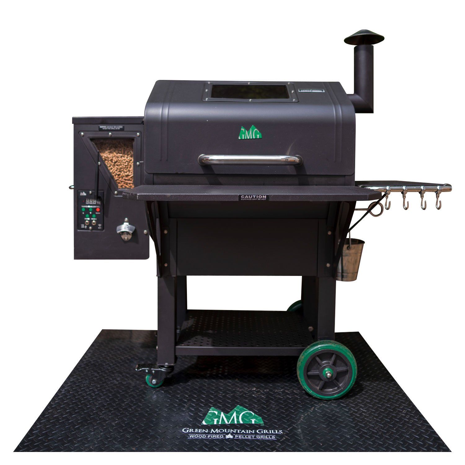 a green mountain grill sits on a black mat