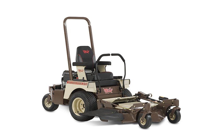 a brown and tan lawn mower with the word krauss on it