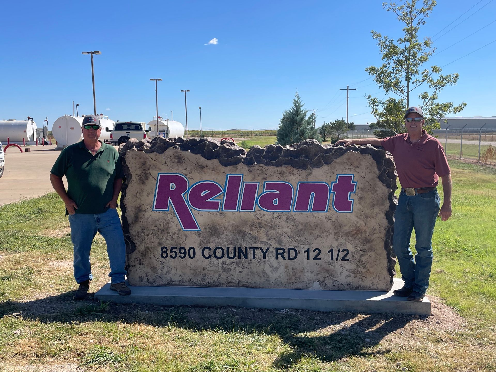 men standing next to reliant boulder 