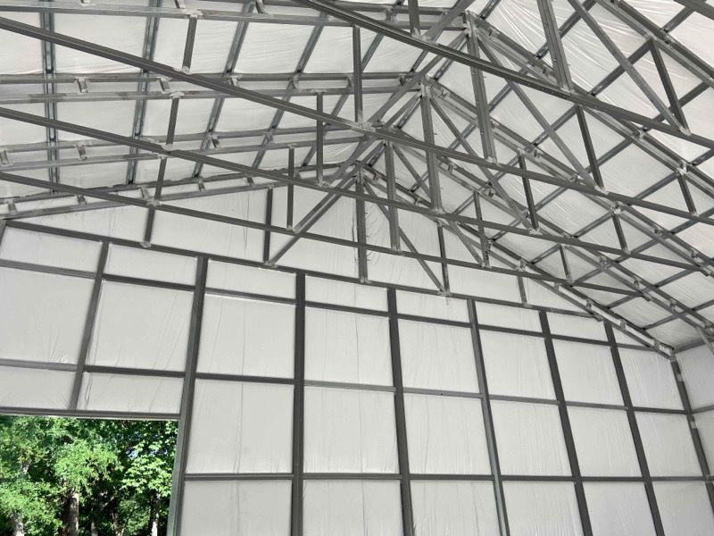 the inside of a building with a roof and walls
