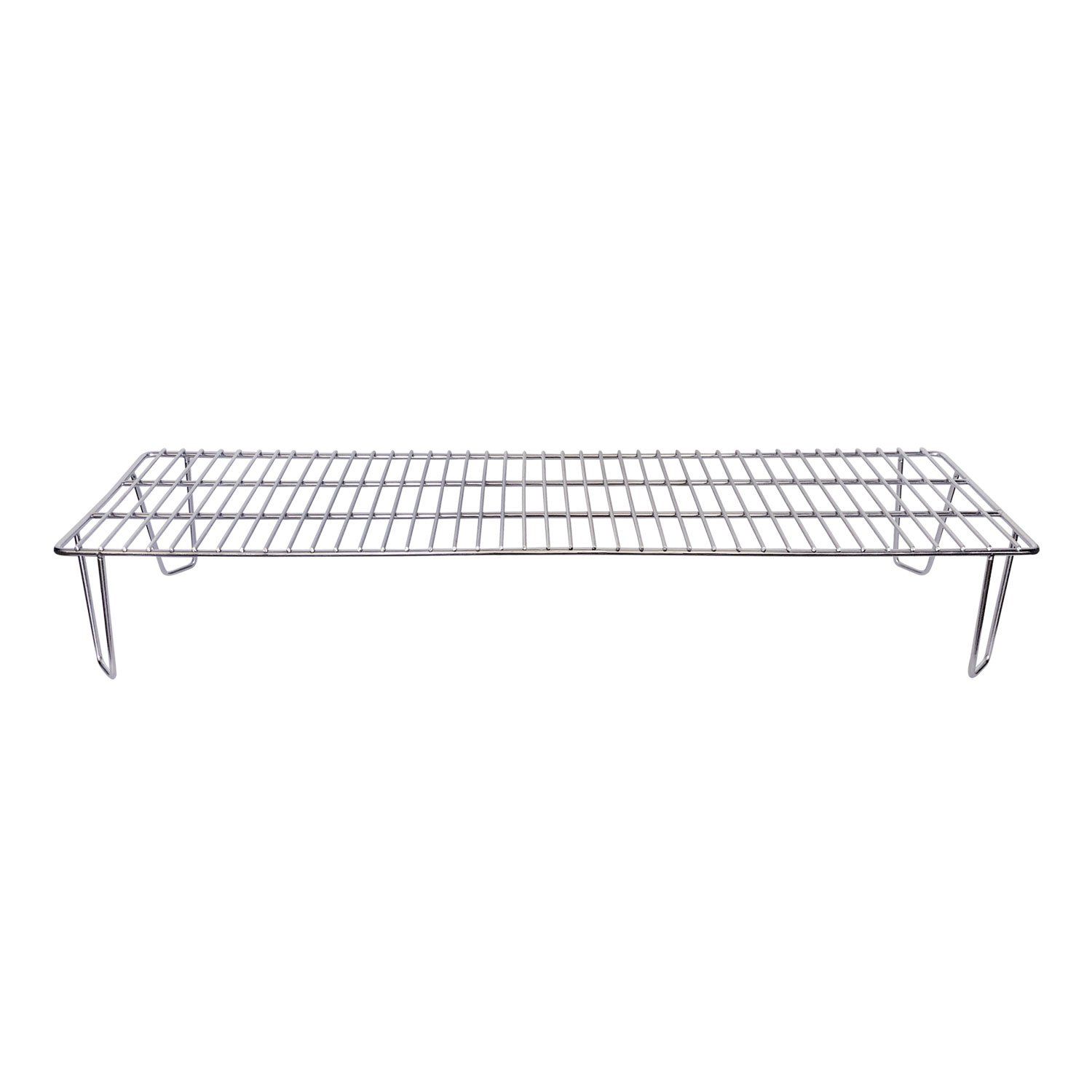 a stainless steel grill sits on a white surface