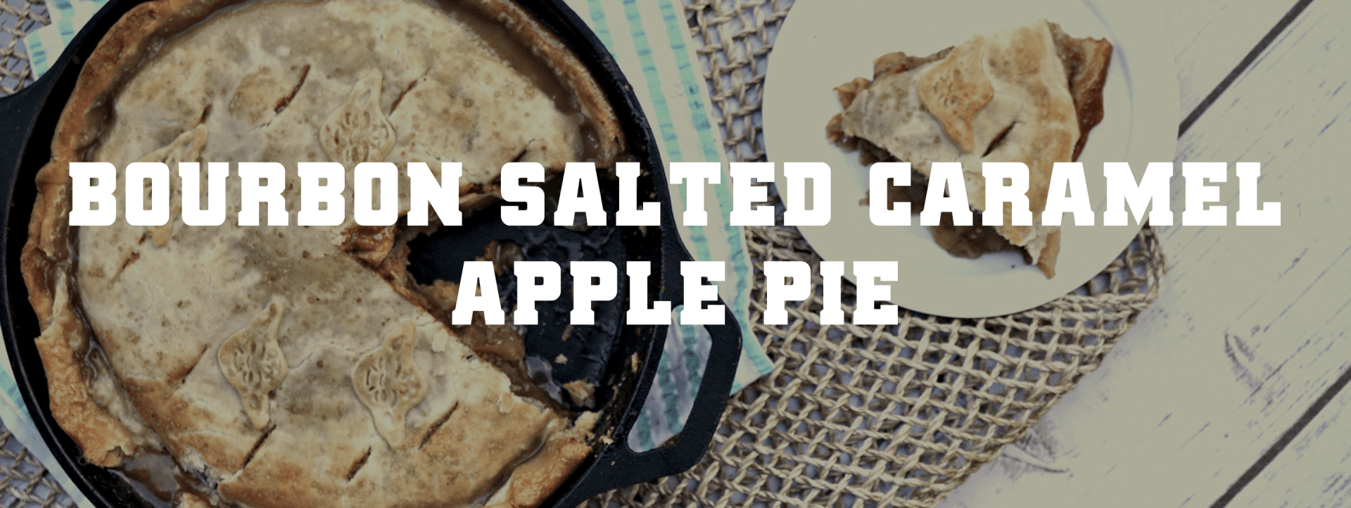 A bourbon salted caramel apple pie with a slice taken out of it