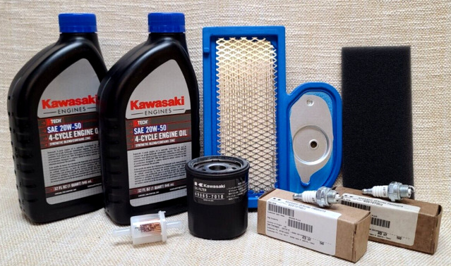 Several bottles of kawasaki oil are sitting on a table
