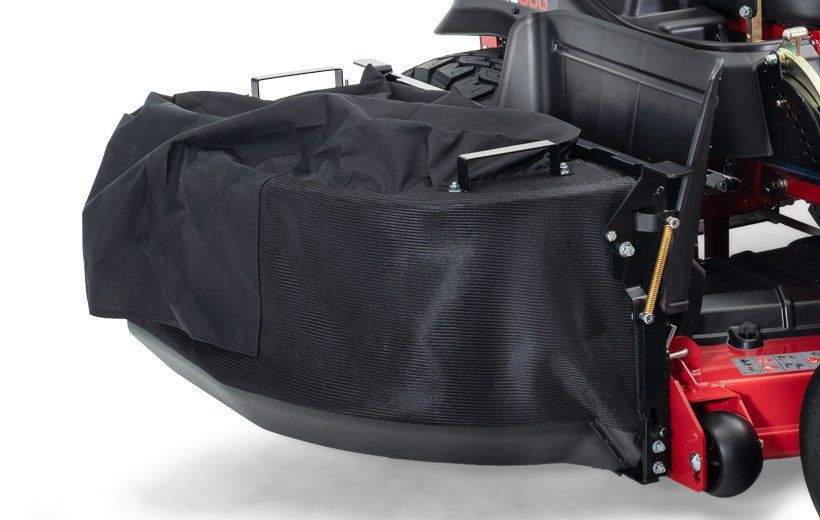 A Big Dog mower with a black bag attached to it