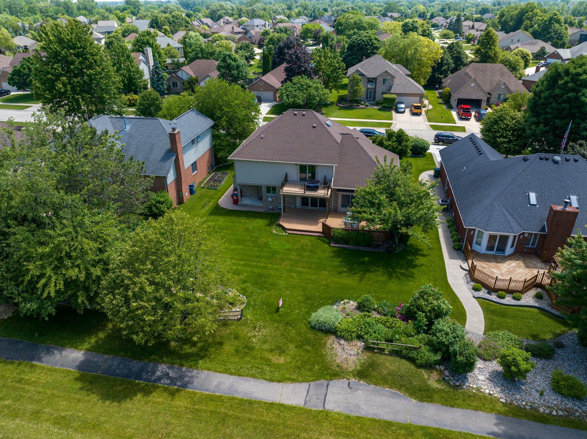 An aerial view of a residential area with lots of houses and trees.