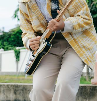 live music image of man playing guitar