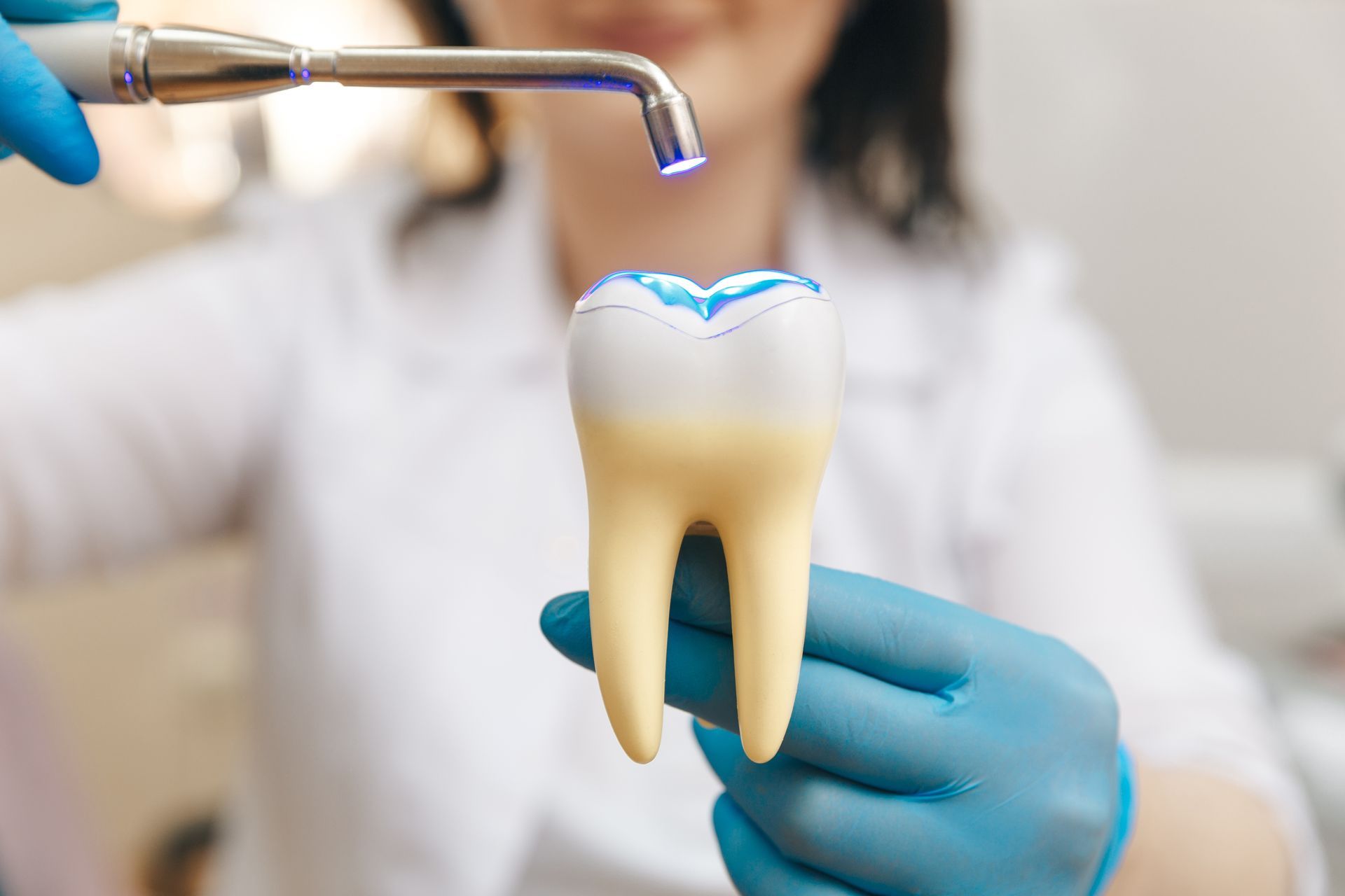 Process of filling on fake tooth.
