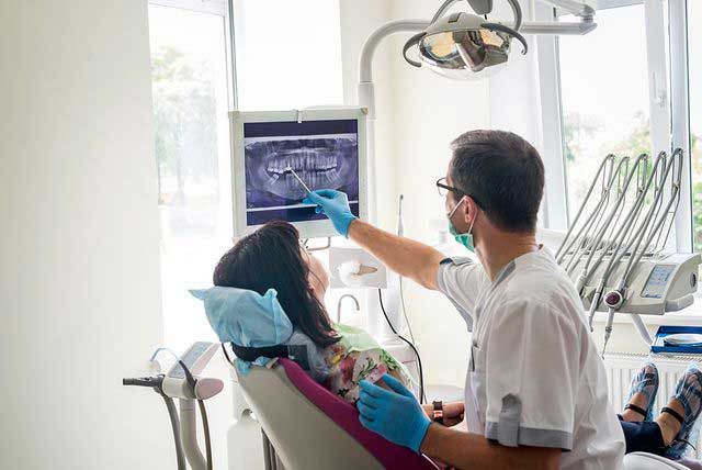 Dentist Showing Dental X-ray to Patient — Depew, NY — Bochiechio Personalized Dentistry