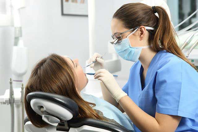 Dentist Examining Patient's Teeth — Depew, NY — Bochiechio Personalized Dentistry