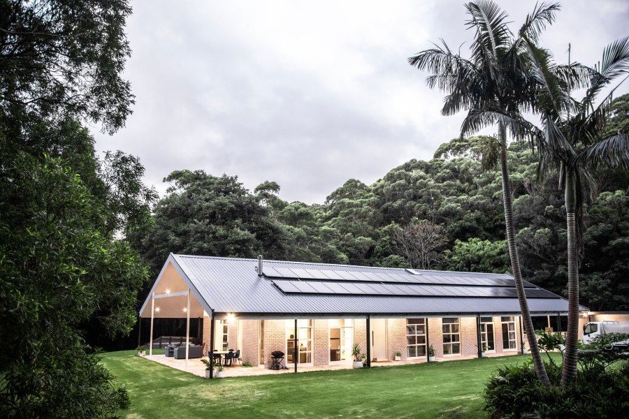 Long, Modern House With Solar Panels On The Roof — LG Constructions in Thirroul, NSW