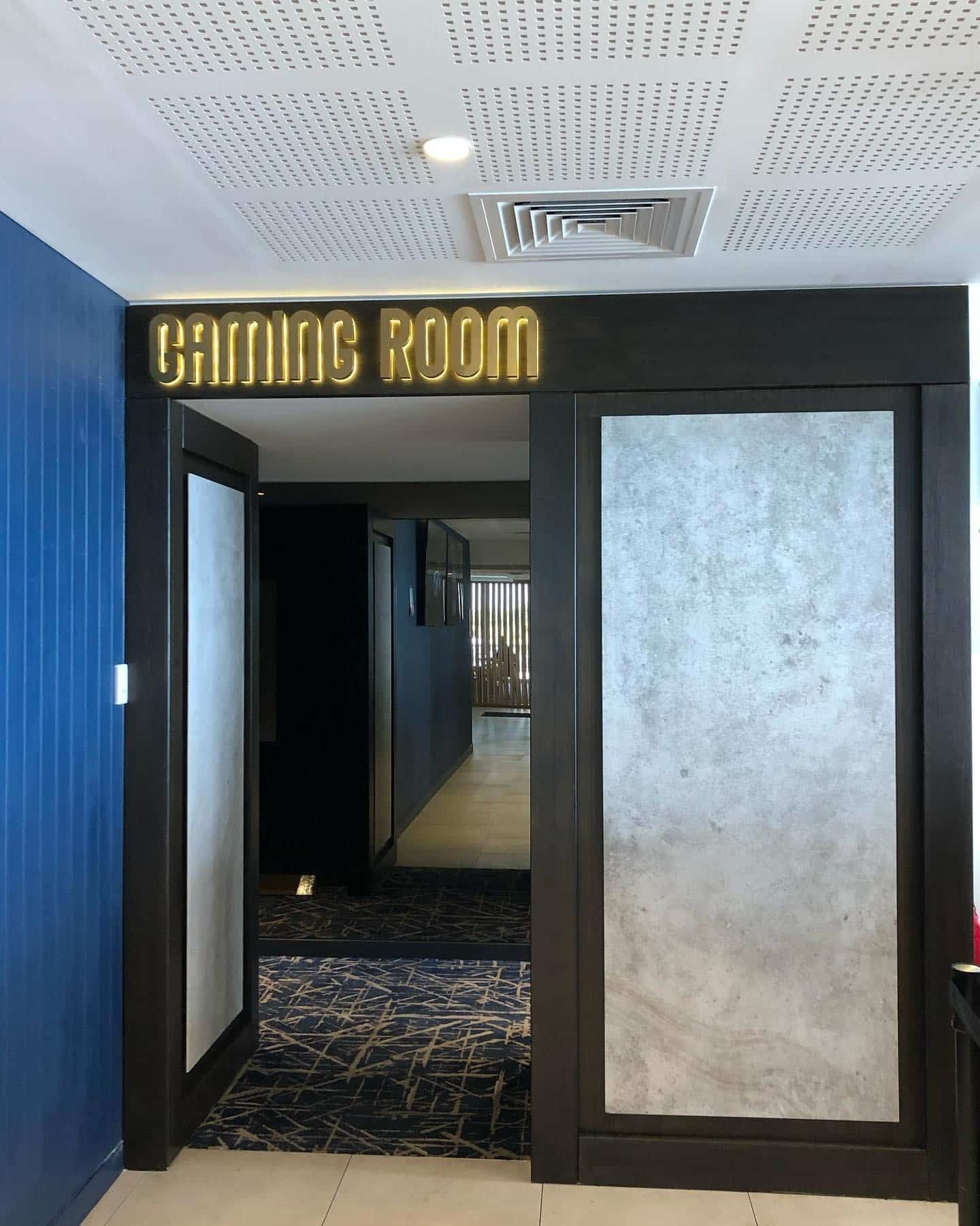 An Additional Room in a Building With a Sign That Says 'Gaming Room' on It — LG Constructions in Thirroul, NSW