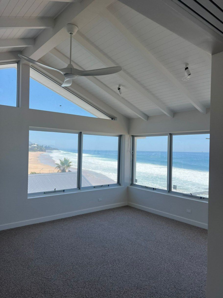 Empty Room With a Vaulted White Ceiling — LG Constructions in Thirroul, NSW