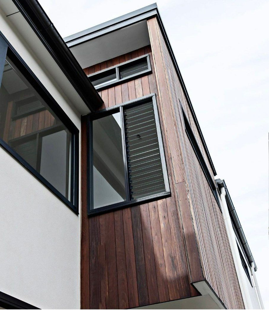 Exterior of a Modern Building With Wood Paneling — LG Constructions in Thirroul, NSW