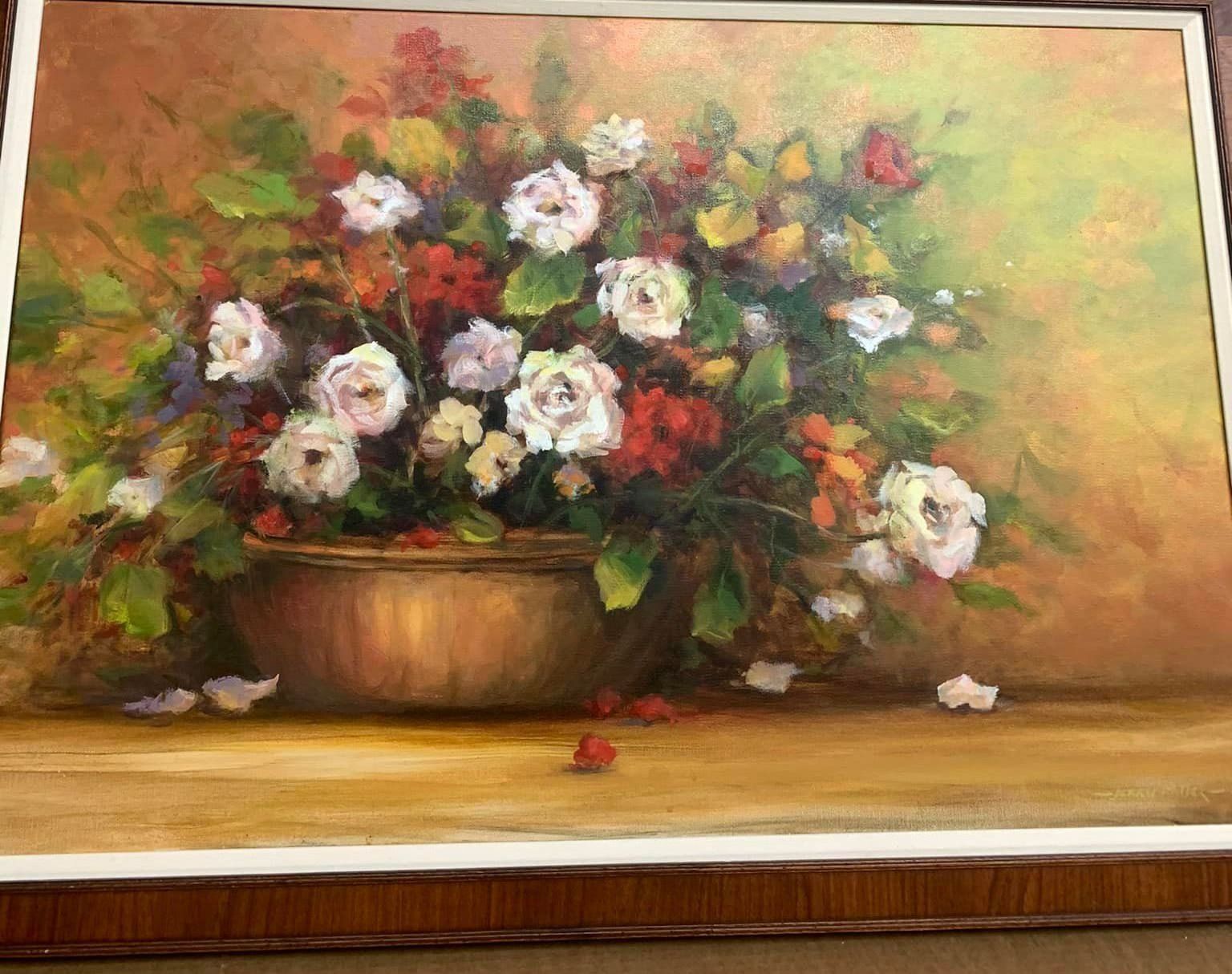 Painting of a flower bouquet in a brown vase on a wooden table, with white and pink blossoms against a warm background