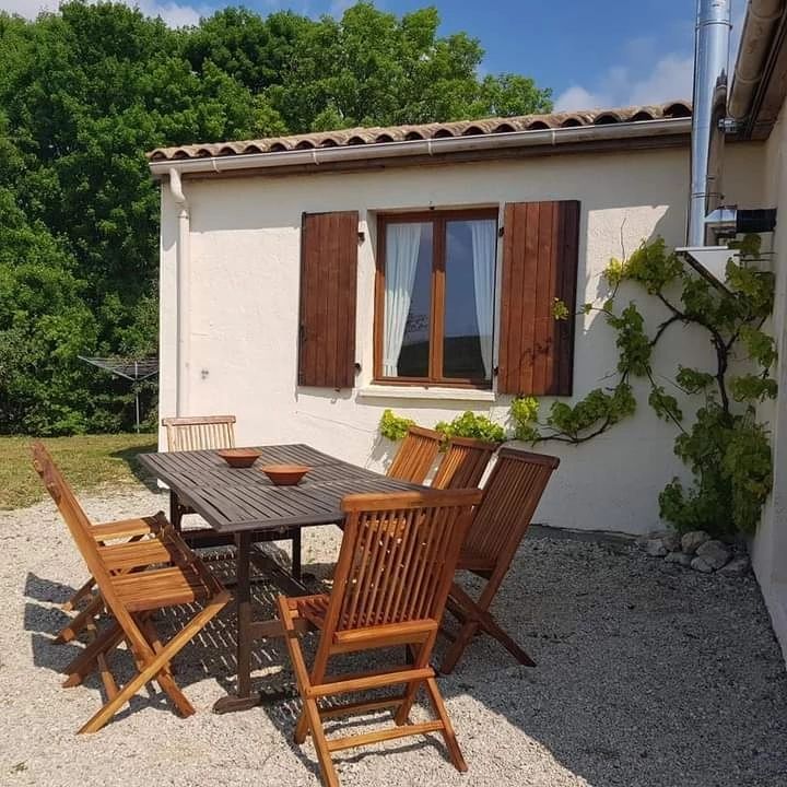 wooden garden table outside French villa