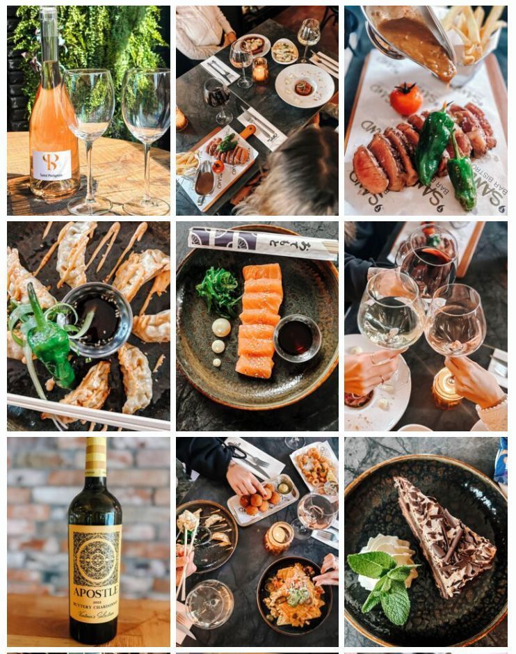 Wijn en sushi, uitgestald in een rustieke buitenruimte met flessen, glazen en opgemaakte gerechten.