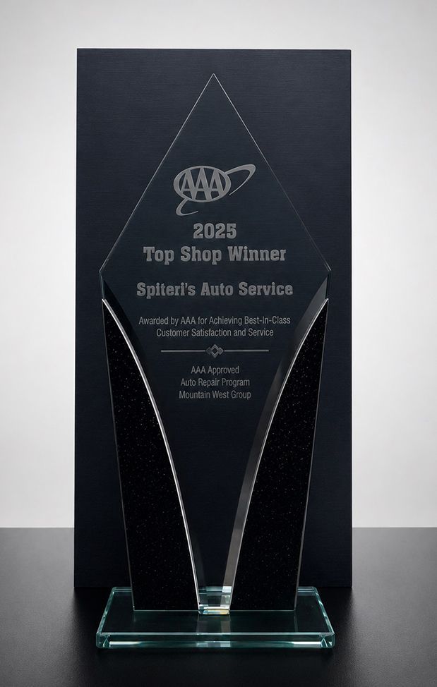 AAA 2025 Top Shop Winner award on desk | Spiteri's Complete Auto Service