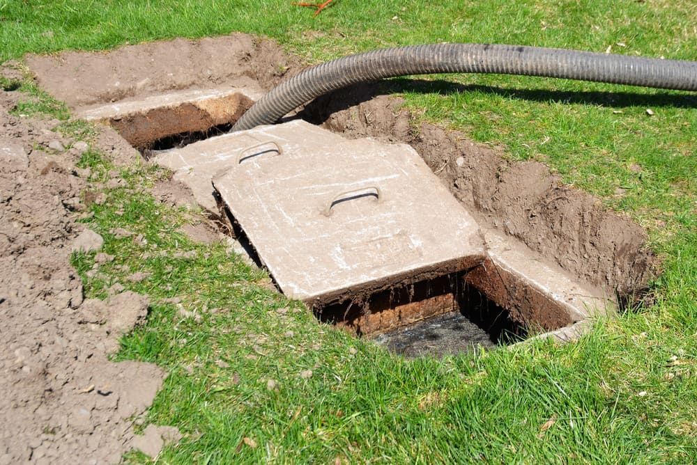 A Septic Tank Is Being Filled With Water By A Hose — All Hours Vac Truck In Lakes Creek, QLD