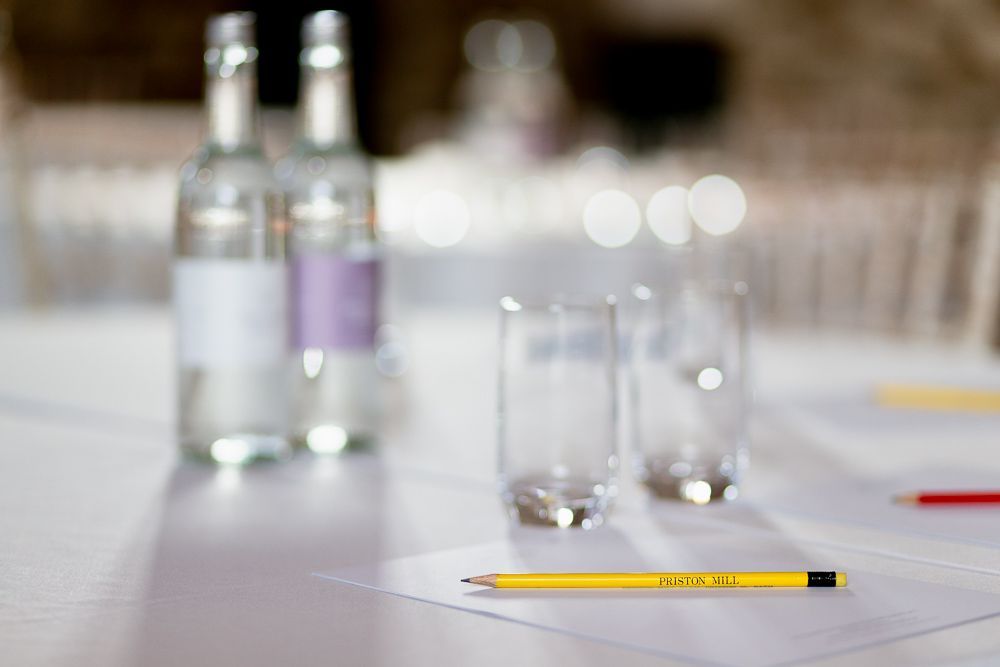 A pencil is sitting on a piece of paper on a table.