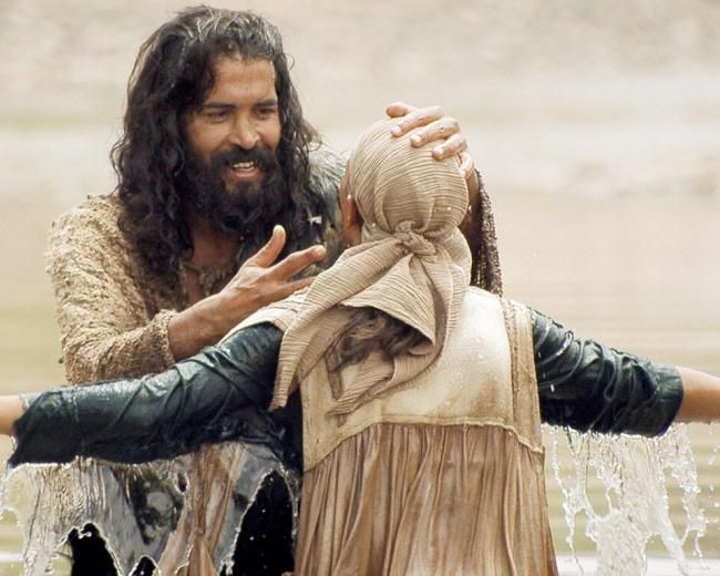 John baptizes a repentant woman