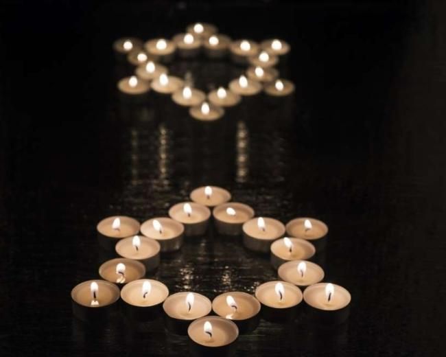 Stars of David made of candles