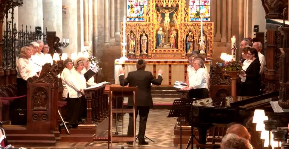 A choir sings before the altar at Christ Chuch Cathedral, Oxford, England