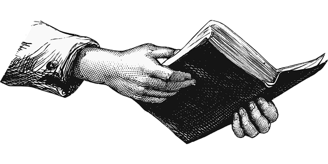 hands holding a book