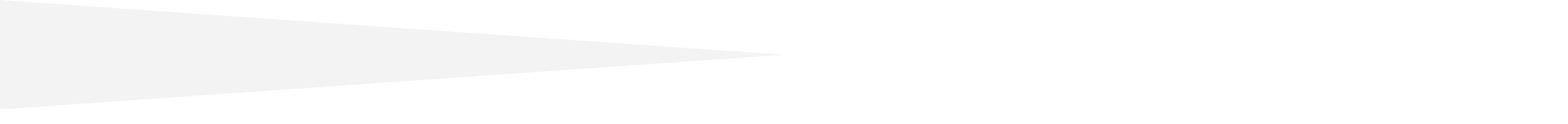 A blurry, light grey shadow on a white background.