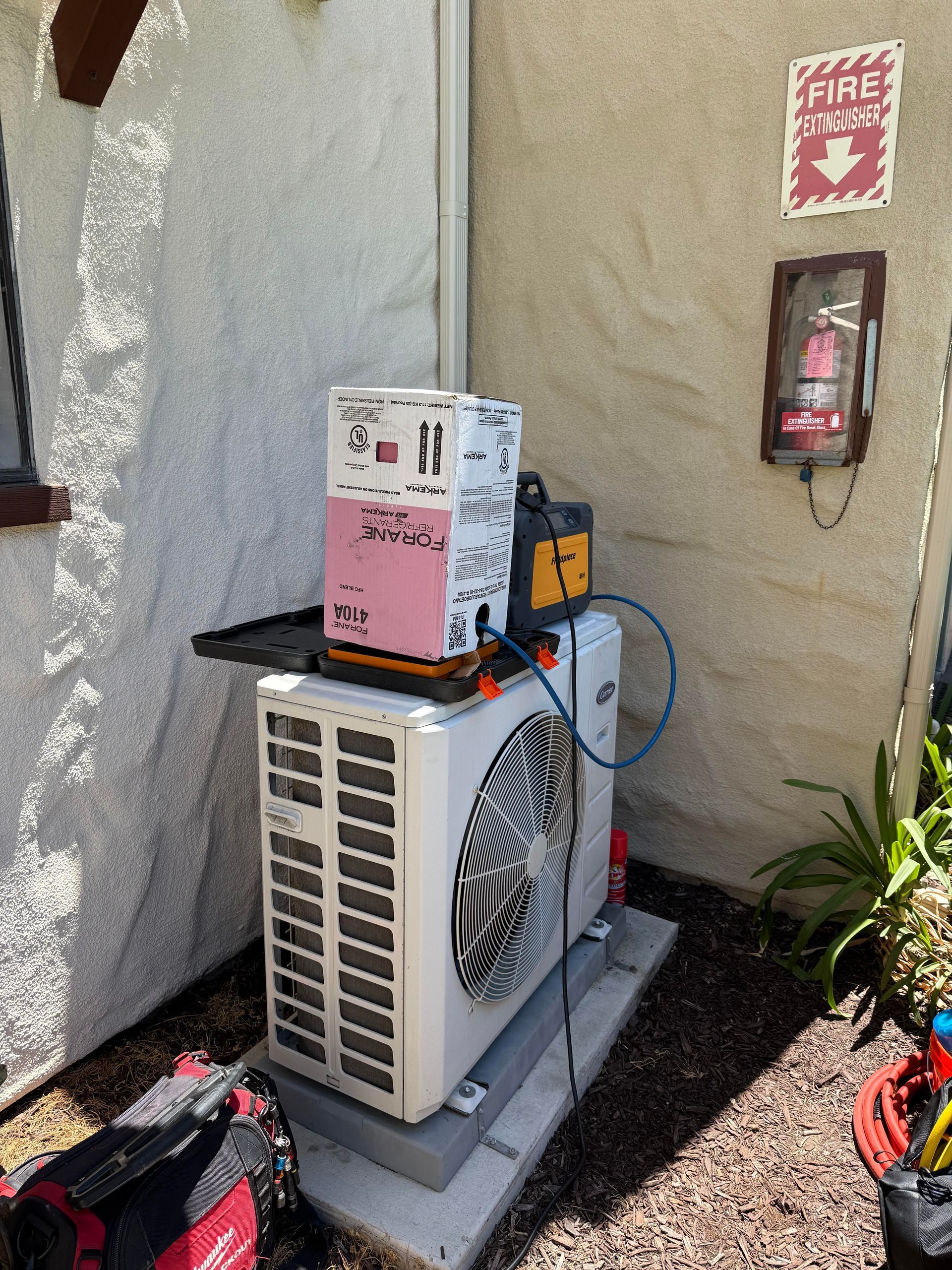 A Carrier AC unit with 410A bottle, Fieldpiece recovery  tool, and refrigerant scale.