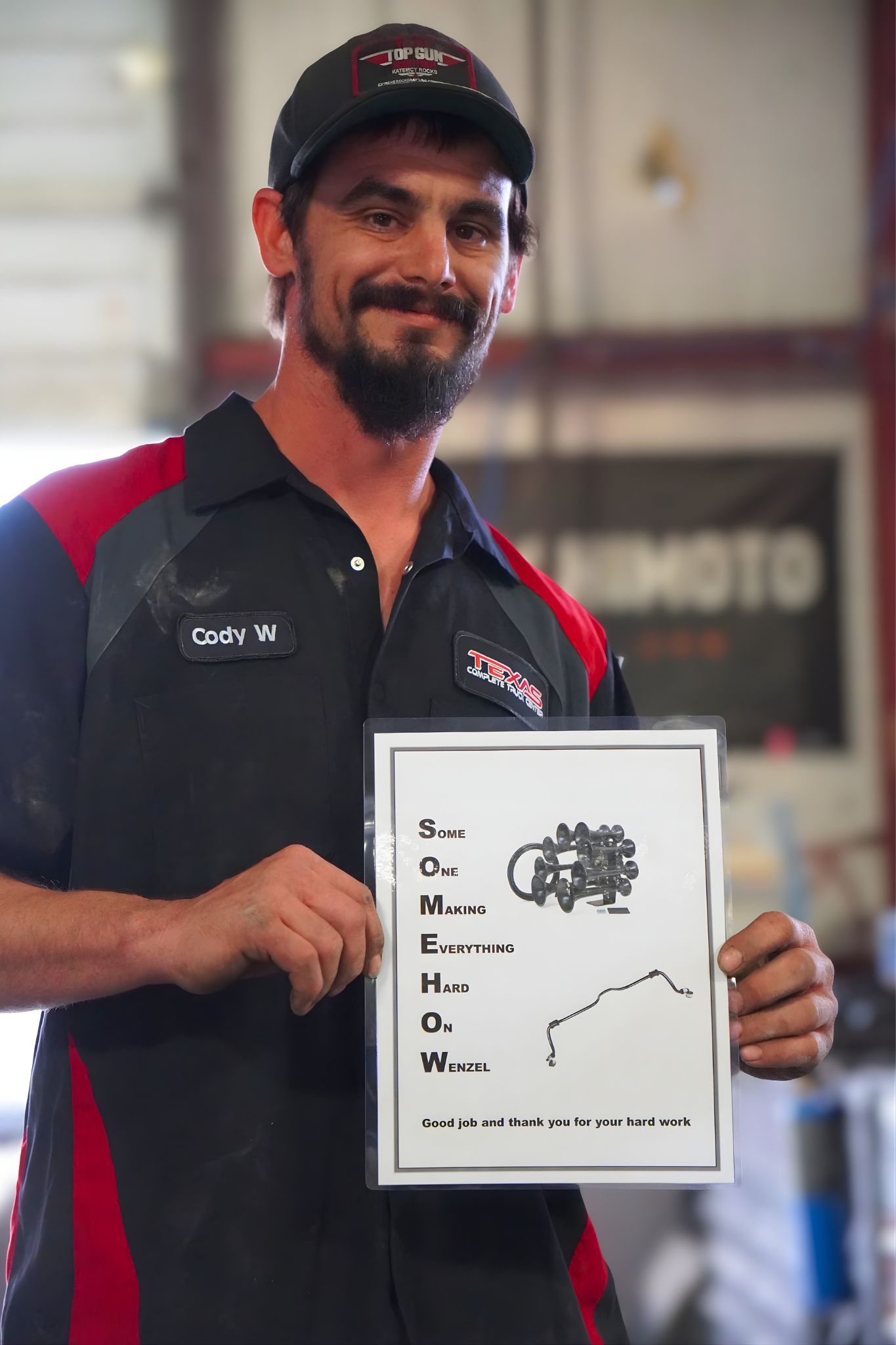 Texas Complete Truck Center Technician Holding Completed Inspection Sheet | Texas Complete Truck Center