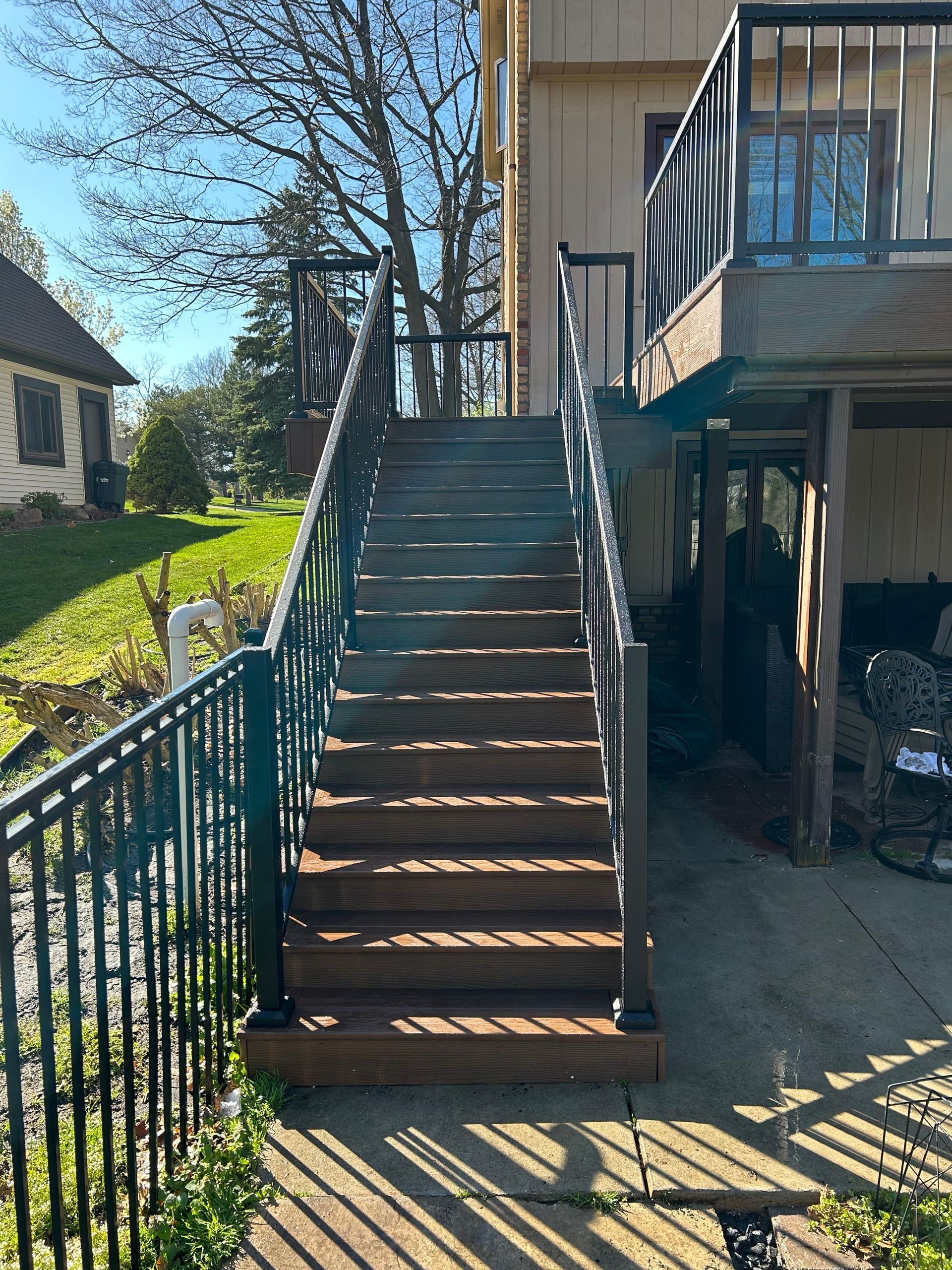 A wooden deck with stairs leading up to it