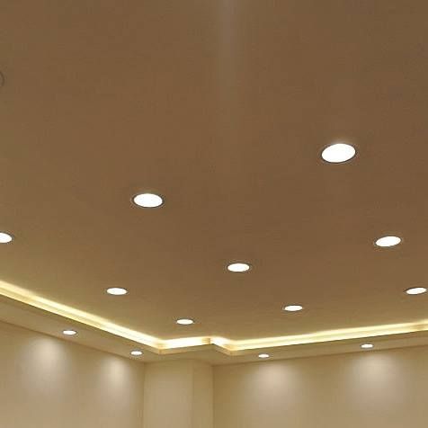A room with a ceiling that has a lot of lights on it.