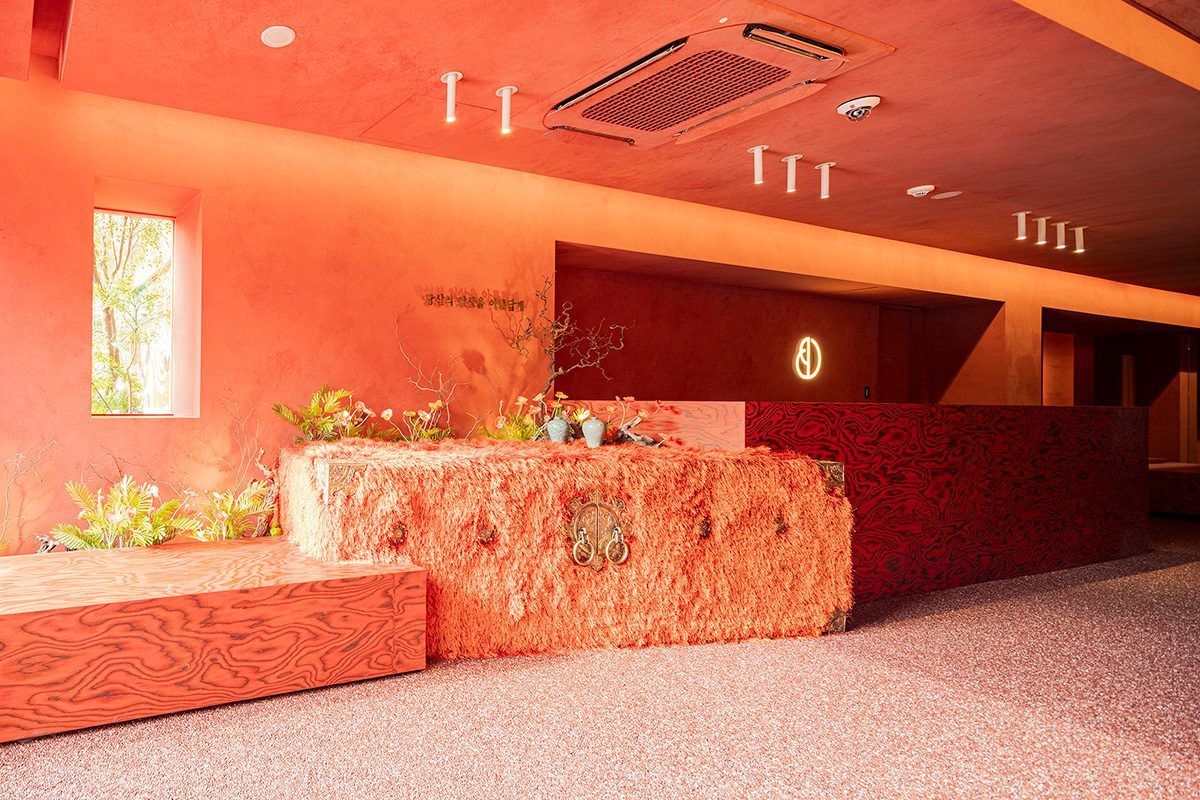 Warm vermilion reception area