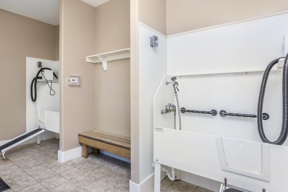 A room with a sink and a bench in it at Marquis Ellis Crossing in Durham, NC.