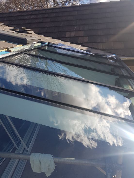 A Glass Roof With a Reflection of Clouds in It — Moss Vale Glass In Colo Vale, NSW