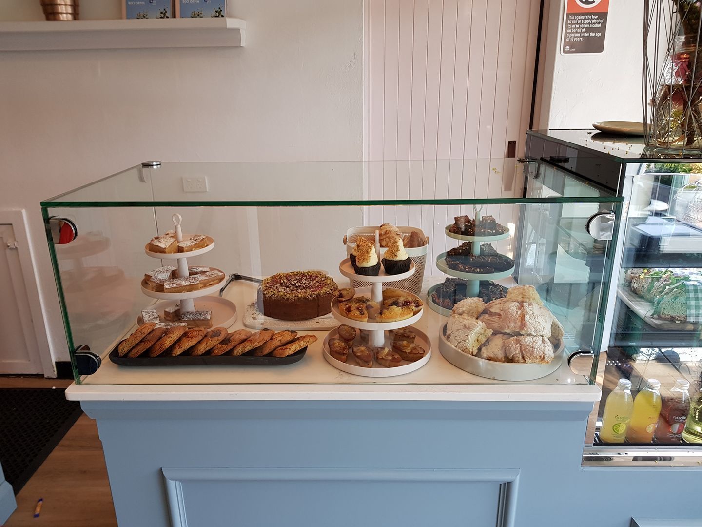 Newly installed cake cabinet with cakes inside — Moss Vale Glass In Moss Vale, NSW