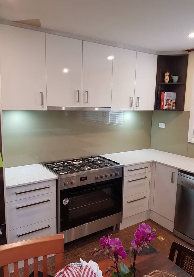 A Kitchen With Newly Installed Green Splashback — Moss Vale Glass In Moss Vale, NSW