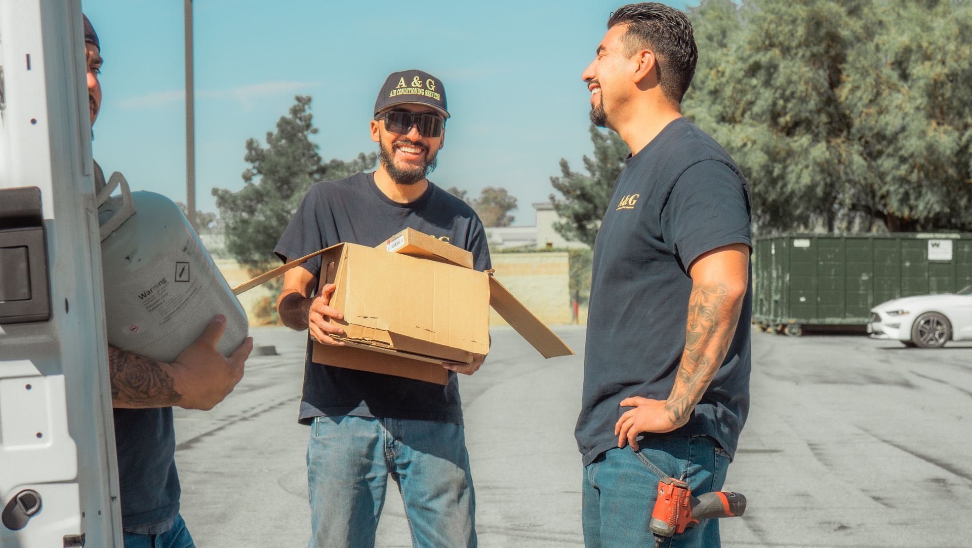 Two A & G Technician are standing next to each other in a parking lot in San Bernardino County.