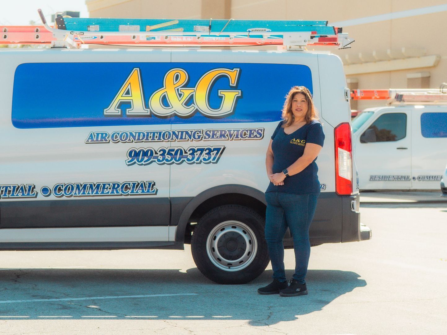 A&G Air Solutions Technician stands in front of work truck. Darlene