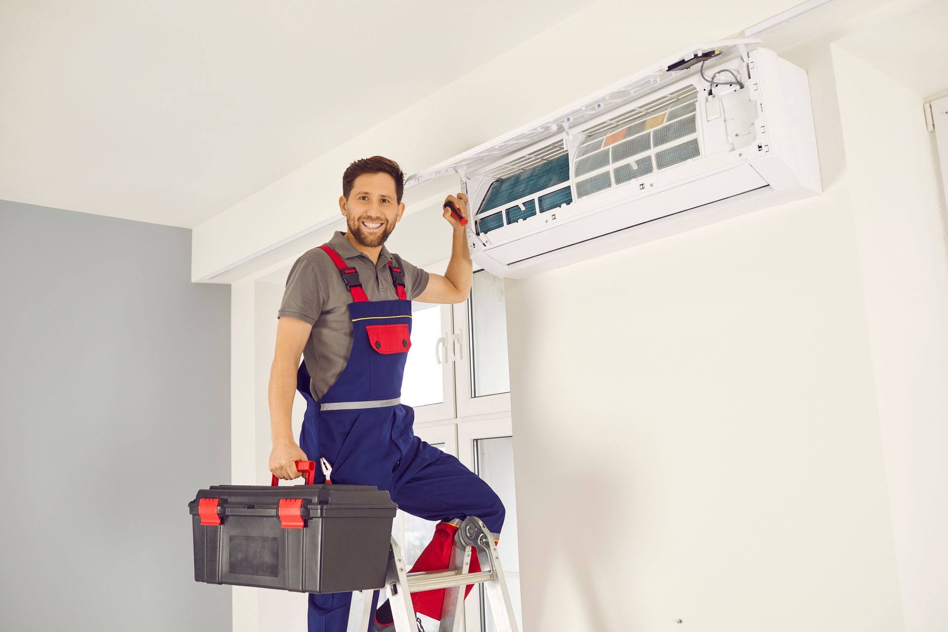 A&G HVAC technician performing spring air conditioner tune-up in Riverside California.