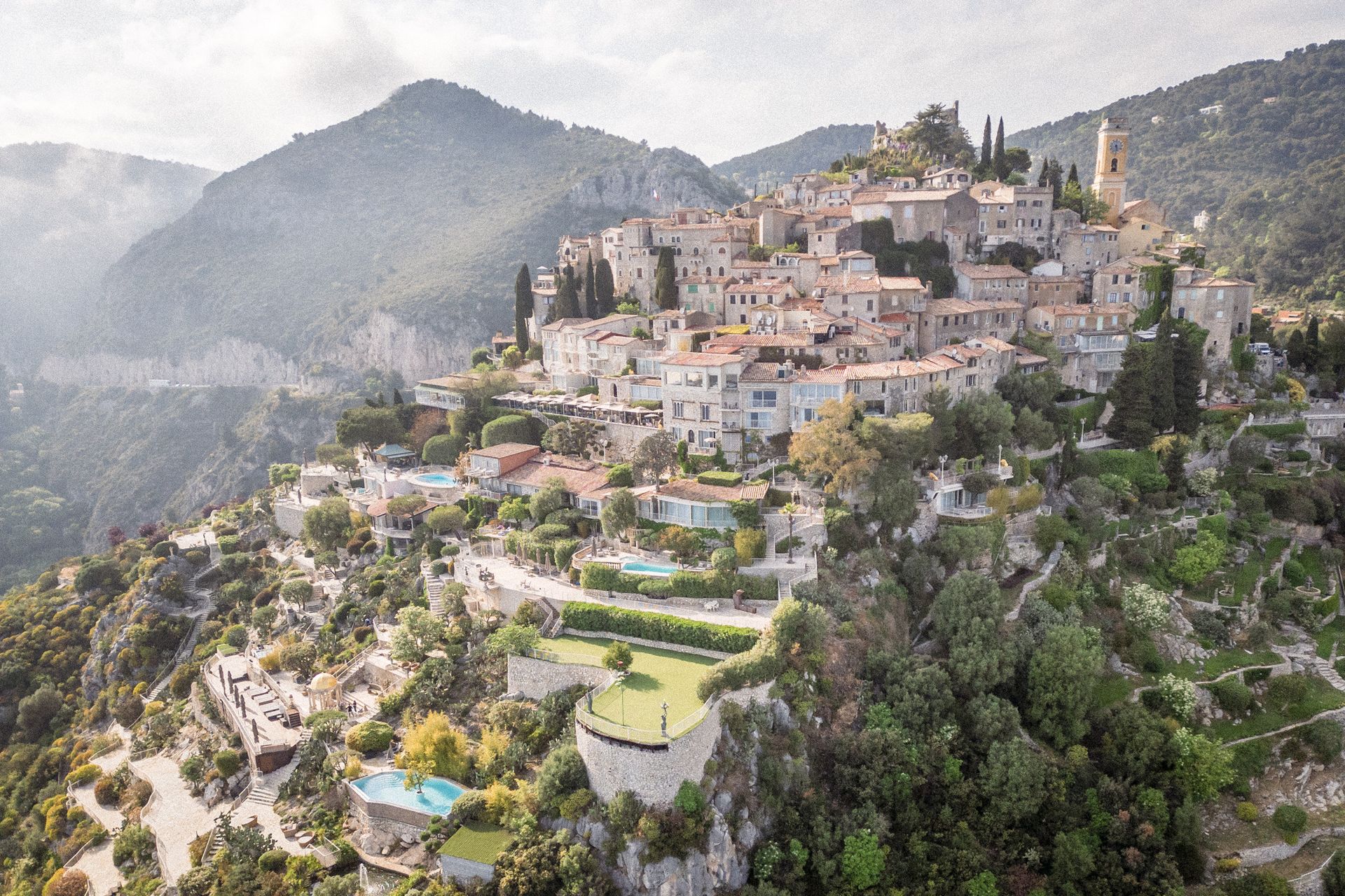 Drone image of Eze's Chevre d'Or Hotel terraces and garden on the French Riviera.